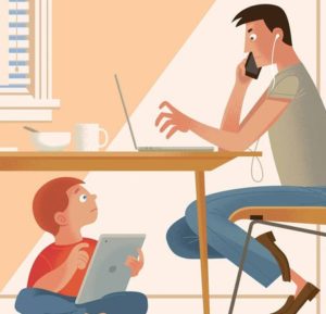 Dad on computer while kid plays with iPad